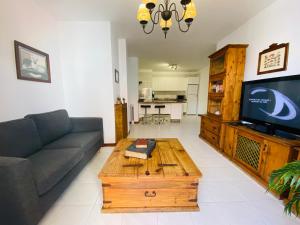 a living room with a couch and a coffee table at Mar Holiday Home in Los Cristianos