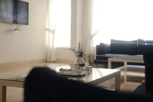TV a/nebo společenská místnost v ubytování Rafa Homes - Al Falah