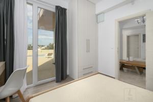 Postel nebo postele na pokoji v ubytování Villa Eurycleia - AKTI homes