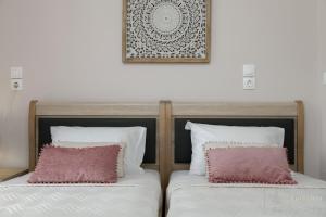 Postel nebo postele na pokoji v ubytování Villa Eurycleia - AKTI homes