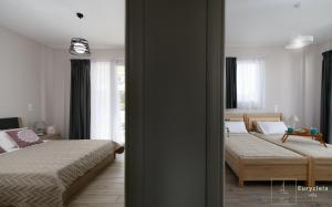 Postel nebo postele na pokoji v ubytování Villa Eurycleia - AKTI homes