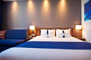 Rúm í herbergi á Holiday Inn Express Strasbourg - Sud by IHG