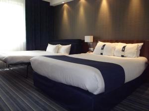 Rúm í herbergi á Holiday Inn Express Strasbourg - Sud by IHG