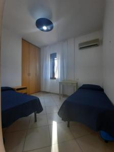 Postel nebo postele na pokoji v ubytování Hotel Villa del Mare Solanas