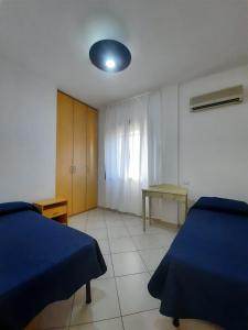 Postel nebo postele na pokoji v ubytování Hotel Villa del Mare Solanas