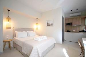 En eller flere senger på et rom på Palm Residences