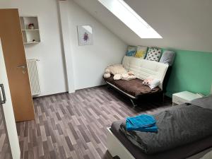 a living room with a couch and a bed at Appartement GL24 in Sankt Margarethen bei Knittelfeld