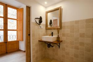 a bathroom with a sink and a mirror at My Rooms Artà Adults Only by My Rooms Hotels in Artá