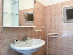 a bathroom with a sink and a mirror at Monolocale Vittorio in Portoferraio