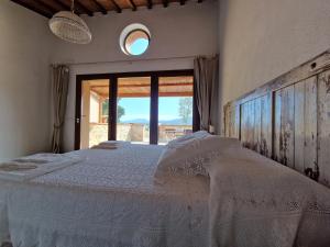 Postel nebo postele na pokoji v ubytování Agriturismo Giù al Pozzo
