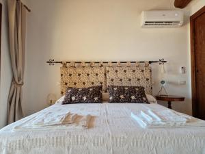 Postel nebo postele na pokoji v ubytování Agriturismo Giù al Pozzo