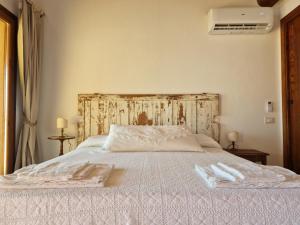Postel nebo postele na pokoji v ubytování Agriturismo Giù al Pozzo