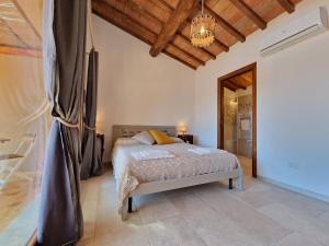 Postel nebo postele na pokoji v ubytování Agriturismo Giù al Pozzo
