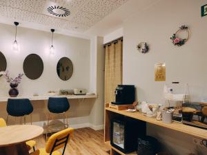 a room with a table and chairs and a table and a table and a table at Habital Suites in Jaca