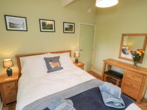 a bedroom with a bed with a dog pillow on it at Lake View Lodge in Scarborough