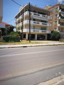 an empty street in front of a building at Jenny's luxury flat near the center & Beach in Kalamata