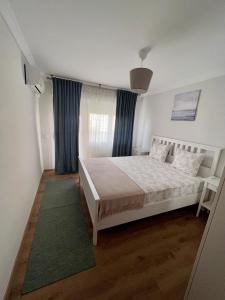Posteľ alebo postele v izbe v ubytovaní Apartamentos Prestige Suites Málaga II