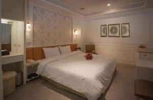 מיטה או מיטות בחדר ב-Showart Hotel