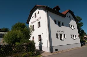 a white building with the words chill kitchen on it at Villa Maya in Horní Planá