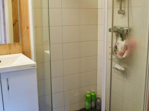 a bathroom with a shower with a glass door at Holiday home NESBYEN II in Nesbyen