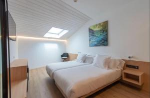 Postel nebo postele na pokoji v ubytování Hotel Cortabitarte