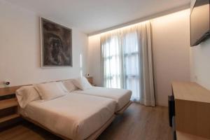 Postel nebo postele na pokoji v ubytování Hotel Cortabitarte