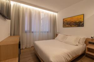 Postel nebo postele na pokoji v ubytování Hotel Cortabitarte
