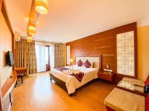 Giường trong phòng chung tại Sapa Elegance Hotel