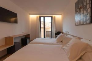 Postel nebo postele na pokoji v ubytování Hotel Cortabitarte