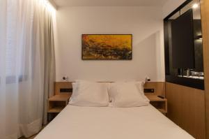 Postel nebo postele na pokoji v ubytování Hotel Cortabitarte
