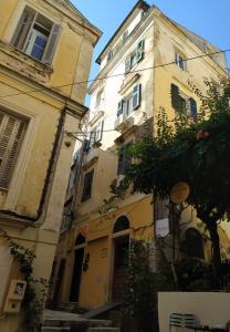 a couple of buildings are next to each other at Casa Collage in Corfu Town