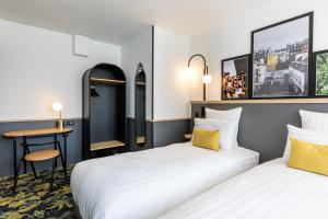 Katil atau katil-katil dalam bilik di Best Western M-Treize Paris Asnieres
