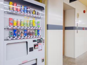 a vending machine filled with lots of drinks at Watergate City in Bangkok