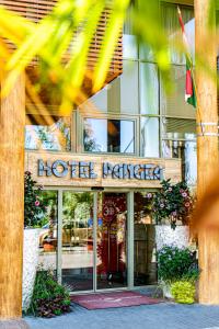 a hotel entrance in front of a building at Pangea Hotel in Nyíregyháza