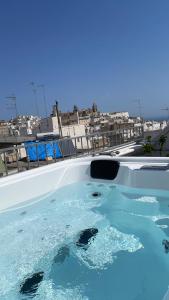 a swimming pool filled with lots of water at 21mq Suite Home in Ostuni