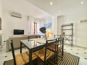 a living room with a glass table and chairs at CasaViva - Wonderful Bilo in Camogli in Camogli