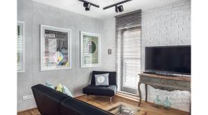 Televízia a/alebo spoločenská miestnosť v ubytovaní BCN Waterlane