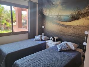Posteľ alebo postele v izbe v ubytovaní Lovely penthouse on the beach, amazing views