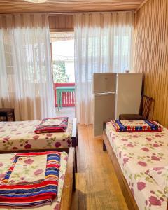 Voodi või voodid majutusasutuse Cottage Коттеджи с балконом toas