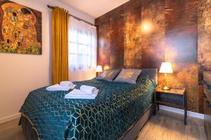 En eller flere senge i et værelse på Apartament Liściasty 1 z tarasem - Dream Apart