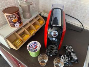 Coffee and tea making facilities at BILOCALE VISTA MARE CON POSTO AUTO