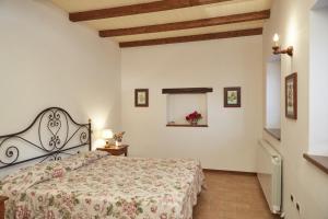 En eller flere senge i et værelse på Agriturismo L'Ulivo