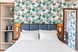 Кровать или кровати в номере Solmaris Tropea Rooms & Suites