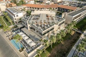 an overhead view of a building with palm trees at Porto Platanias Beach Resort & Spa in Plataniás