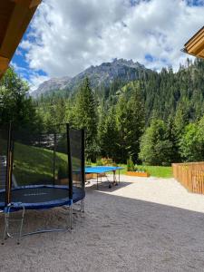 two ping pong tables with a view of a mountain at Apartments Oberhollenzer in Braies