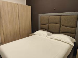 A bed or beds in a room at Fantasia B&B APARTAMENT STUDIO