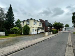 a house on the side of a street at Gästehaus 2 Norden in Norden