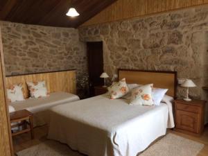 A bed or beds in a room at CASA PARDAL
