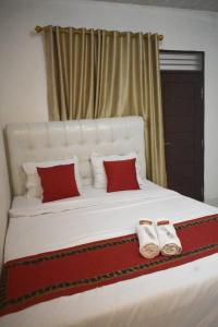 Ένα ή περισσότερα κρεβάτια σε δωμάτιο στο Homestay Legundi Syariah