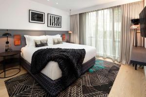 Voodi või voodid majutusasutuse QT Queenstown toas